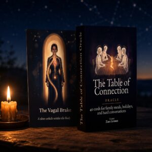 The Table of Connection Oracle box beside The Vagal Brake card on a wooden sill at dusk, lit by a single candle